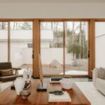 Modern living room with large windows overlooking garden