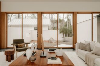 Modern living room with large windows overlooking garden