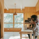 person sitting on chair in front of table