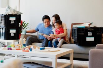 man and woman sitting on couch