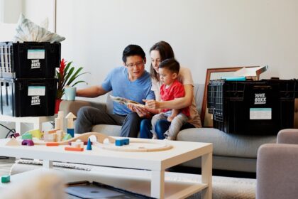 man and woman sitting on couch